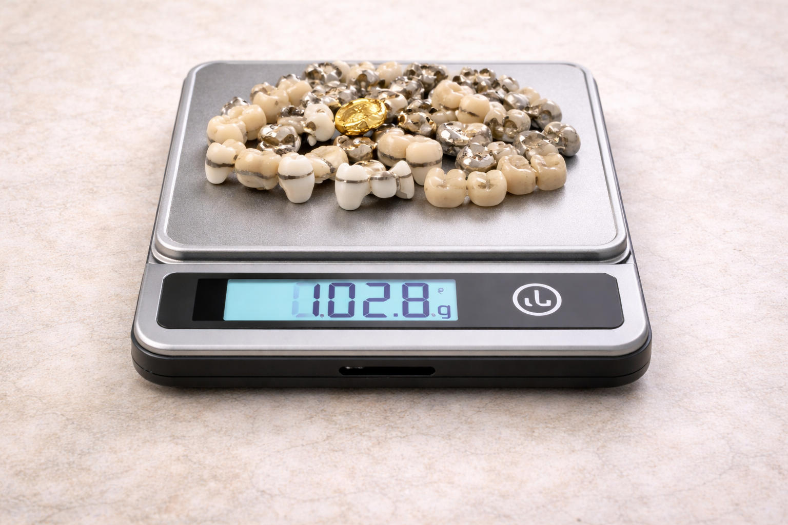 Dental scrap with porcelain/ceramic content affecting recoverable metal